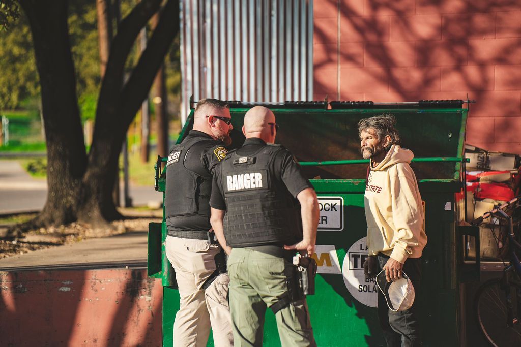 A man wearing a vest that says ranger on it