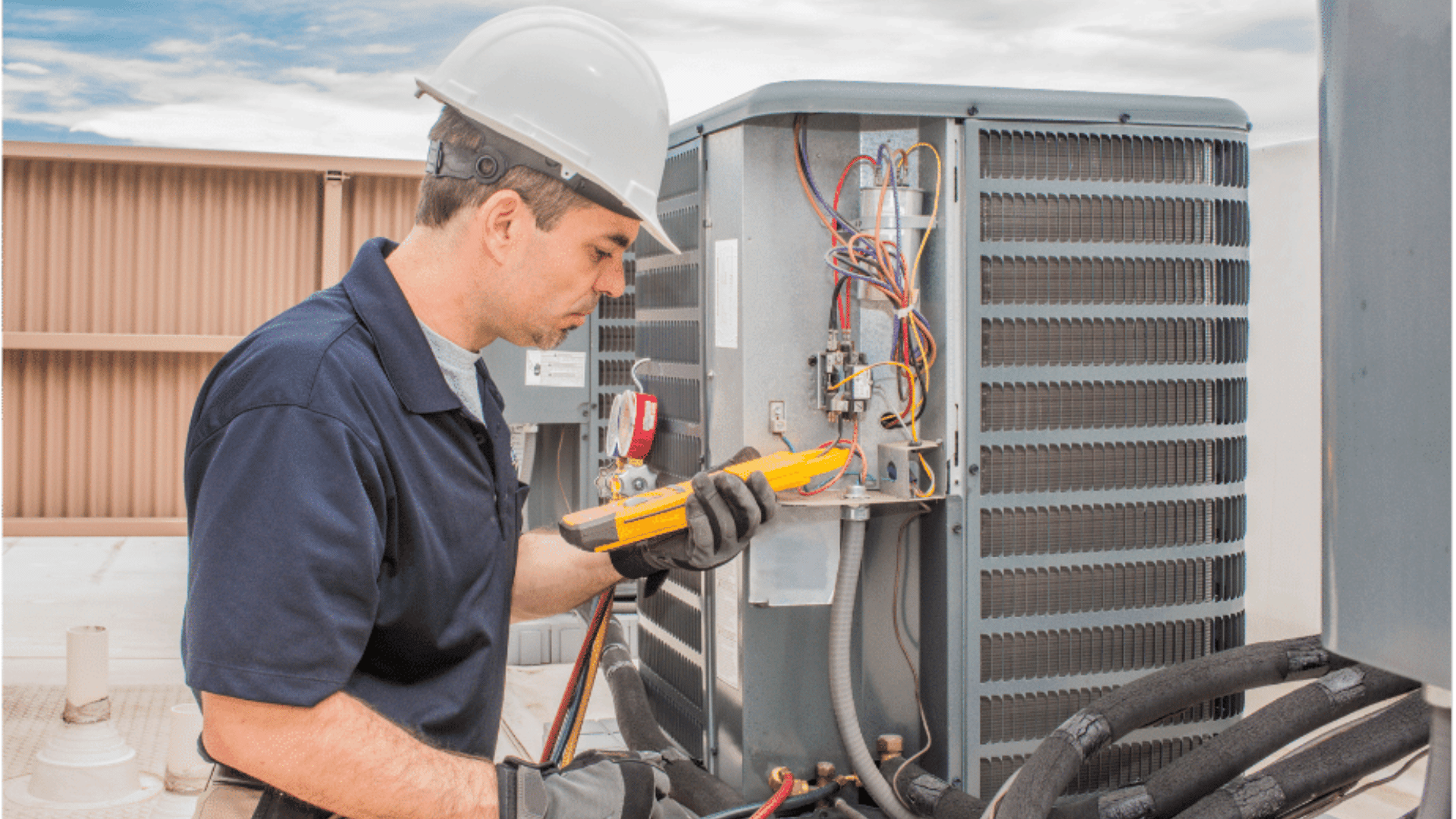 American Air Services, LLC - HVAC repairman testing wiring on outdoor AC unit during residential HVAC repair