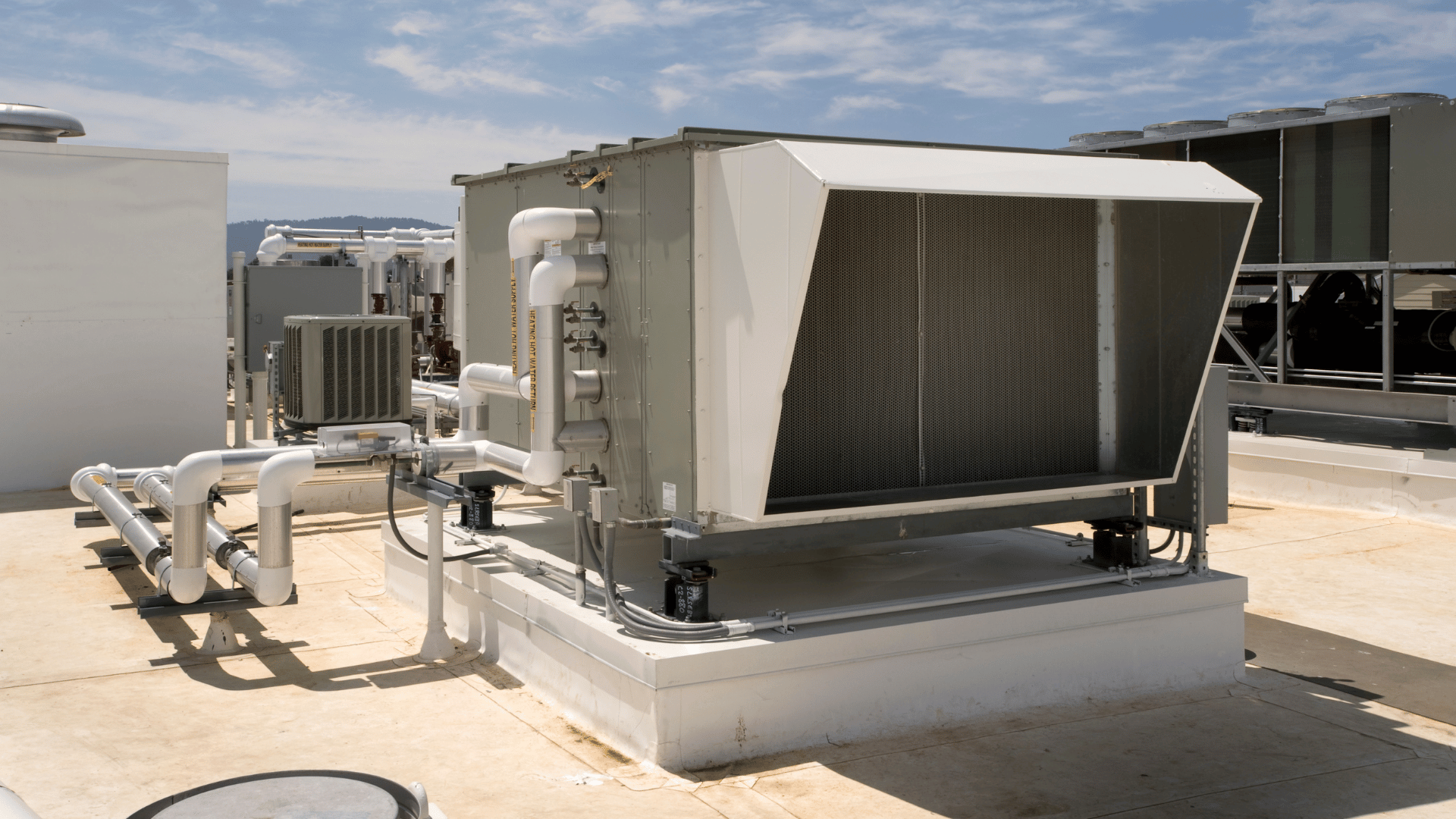 American Air Services, LLC - Large-scale rooftop HVAC installation unit with insulated ducting and piping
