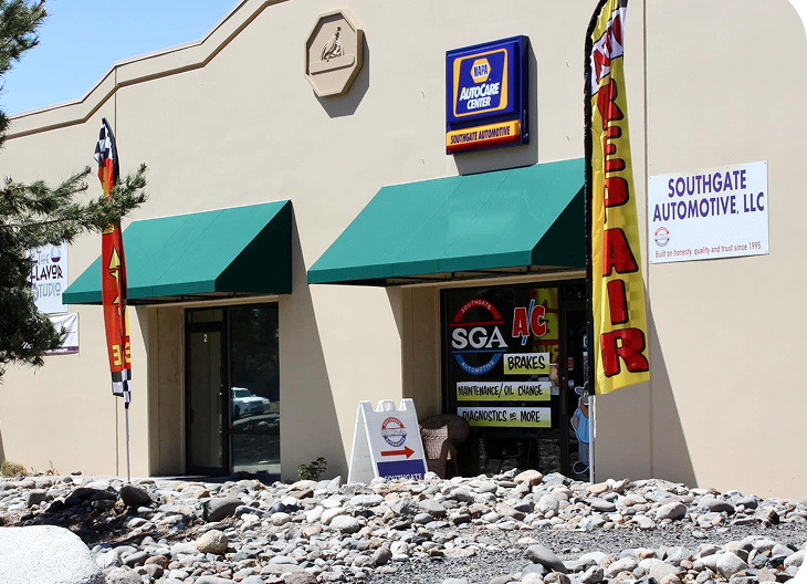 Southgate Automotive LLC shop with green awnings, NAPA sign, and repair flag. | Southgate Automotive