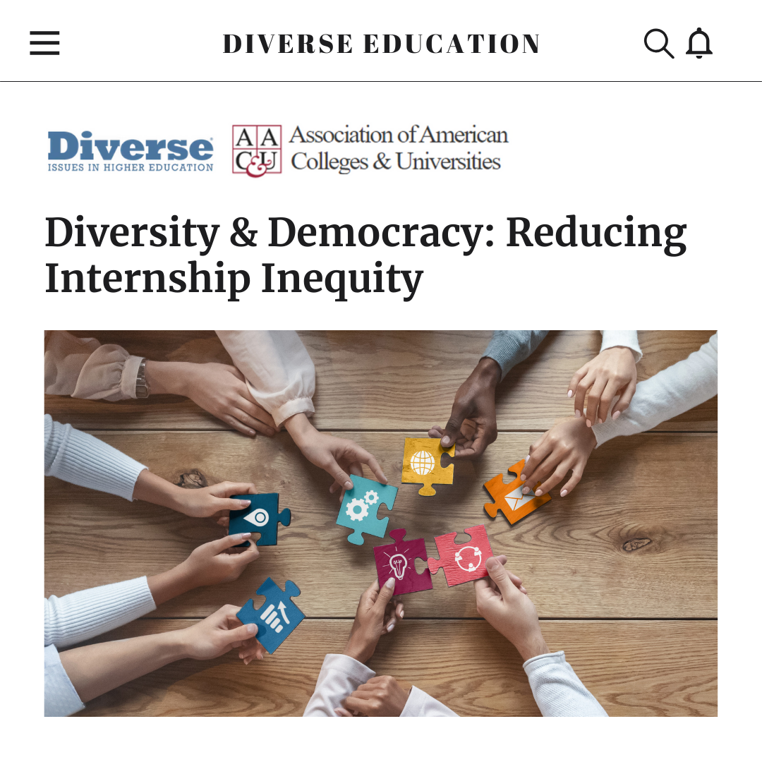 A group of people are holding puzzle pieces around a wooden table.