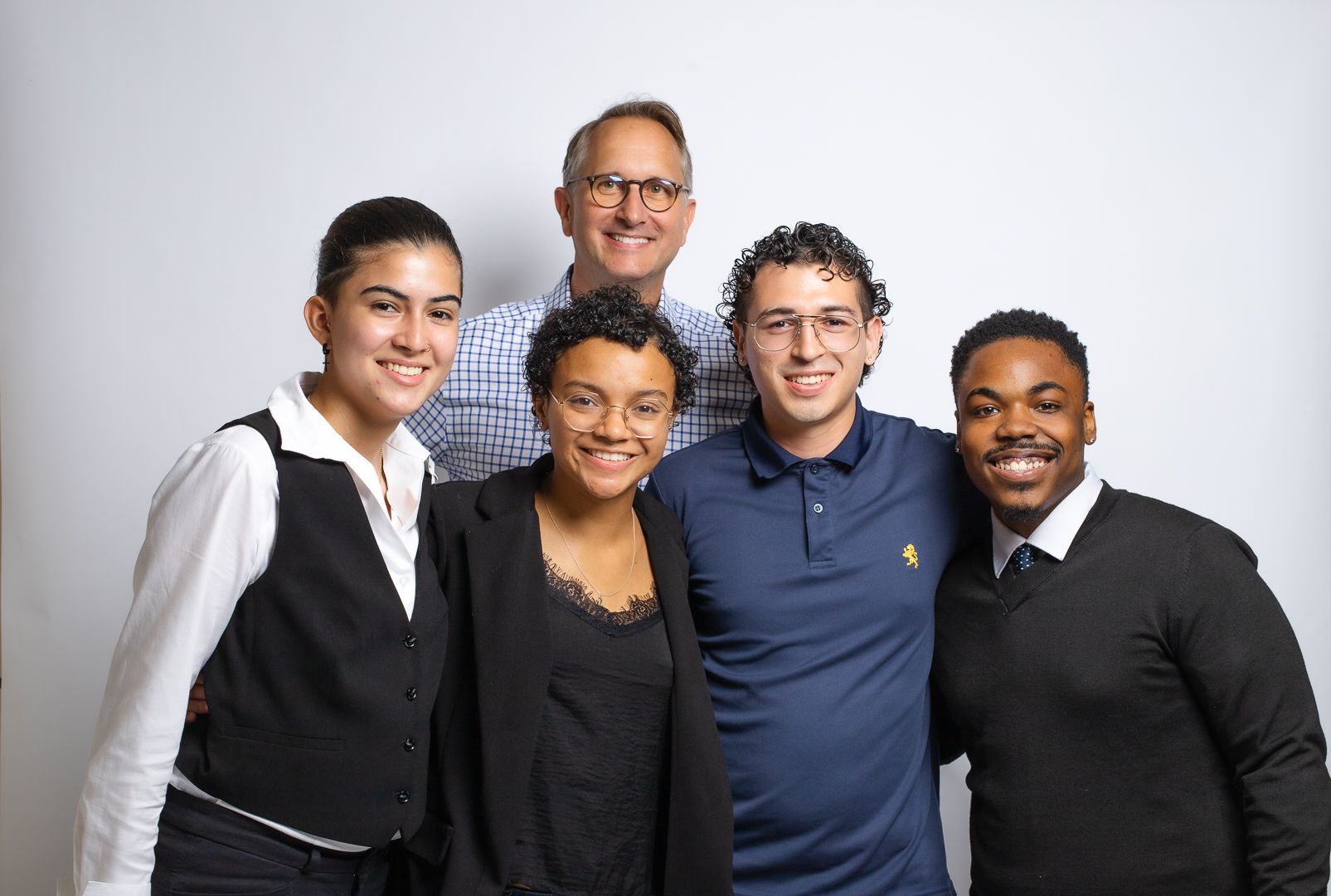 A group of people are posing for a picture together.