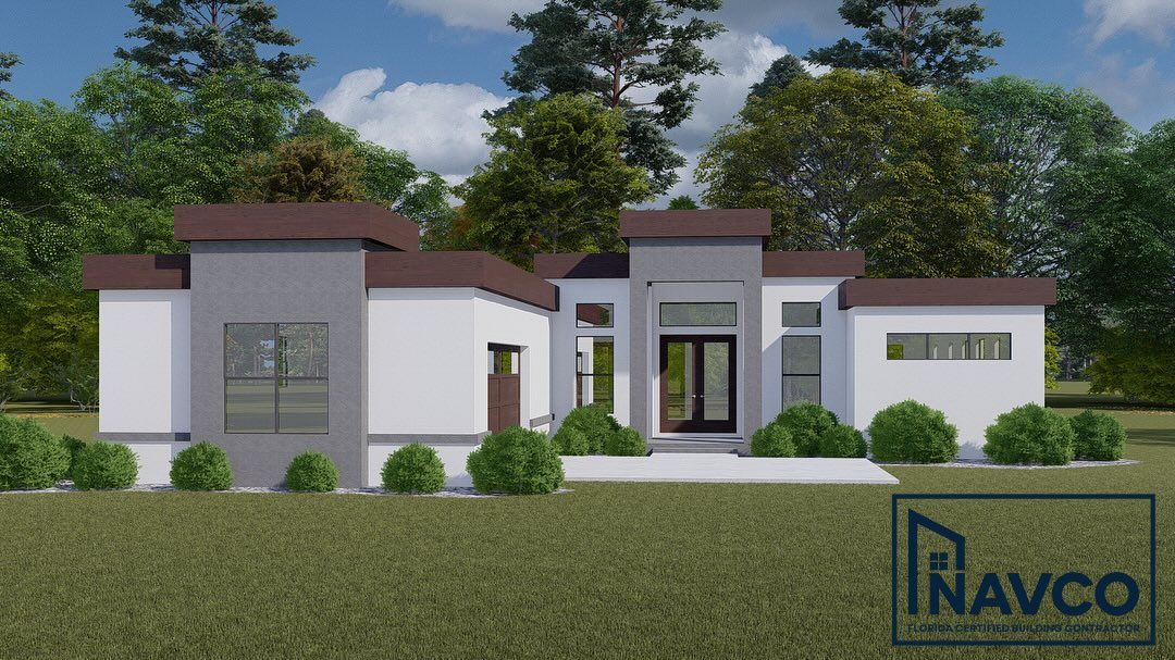 Modern one-story house with white walls, a gray feature wall, and dark brown roofline, set against a backdrop of trees.