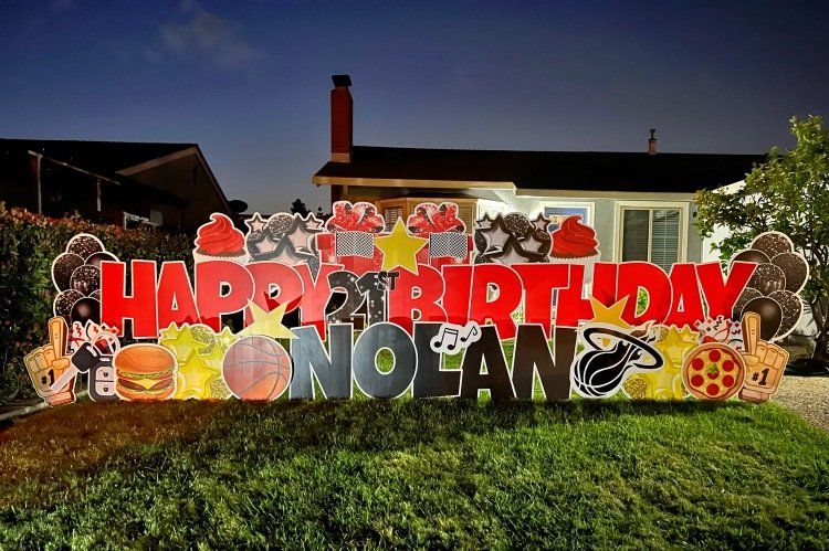 Birthday yard card in red and black. 