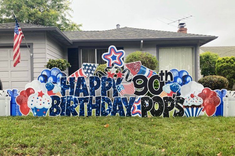Birthday yard card in red, blue, and white. Fourth of July theme. 