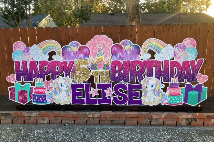 Birthday yard card in pink and purple. Unicorn theme. 