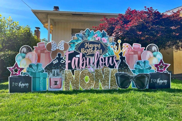 Birthday yard card in pink and teal. 