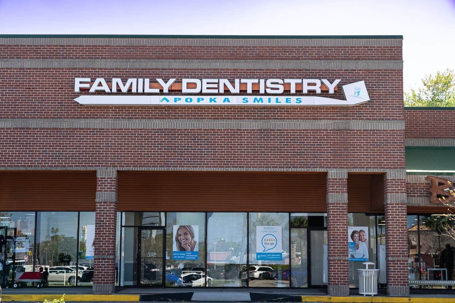 A brick building with a sign that says family dentistry
