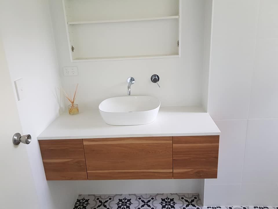A Bathroom with A Sink and A Mirror — Semrau Constructions In Bentley Park, QLD