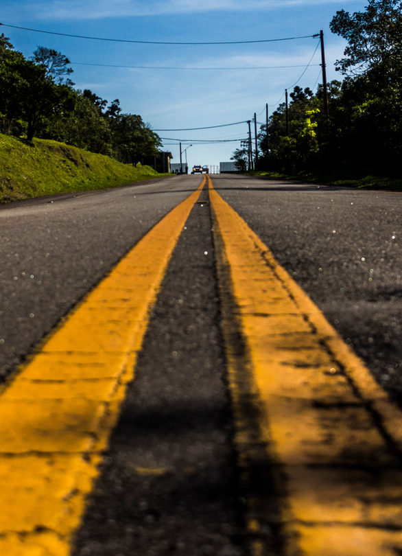 A yellow line on the side of a road