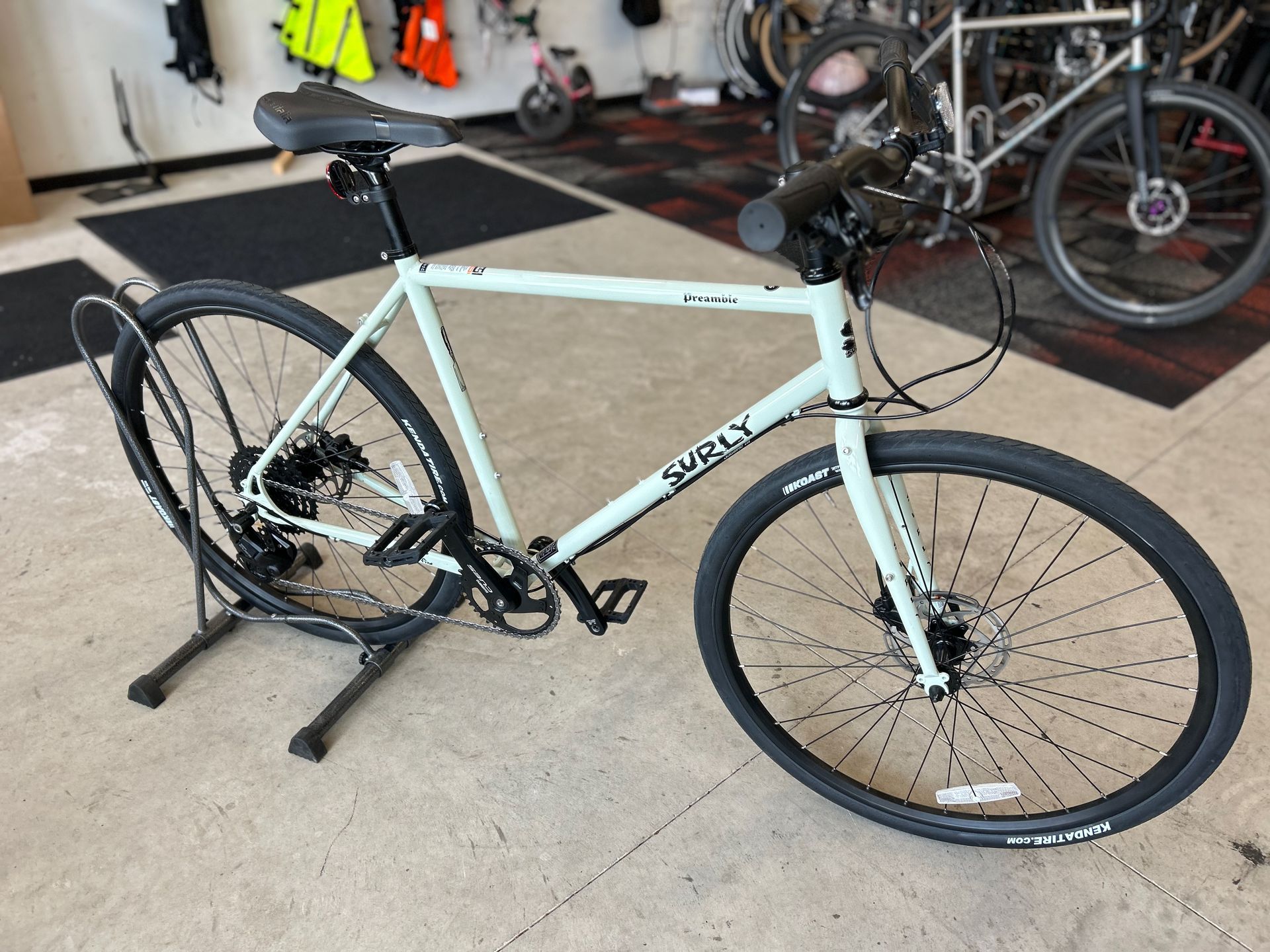 A bicycle is sitting on a stand in a room.