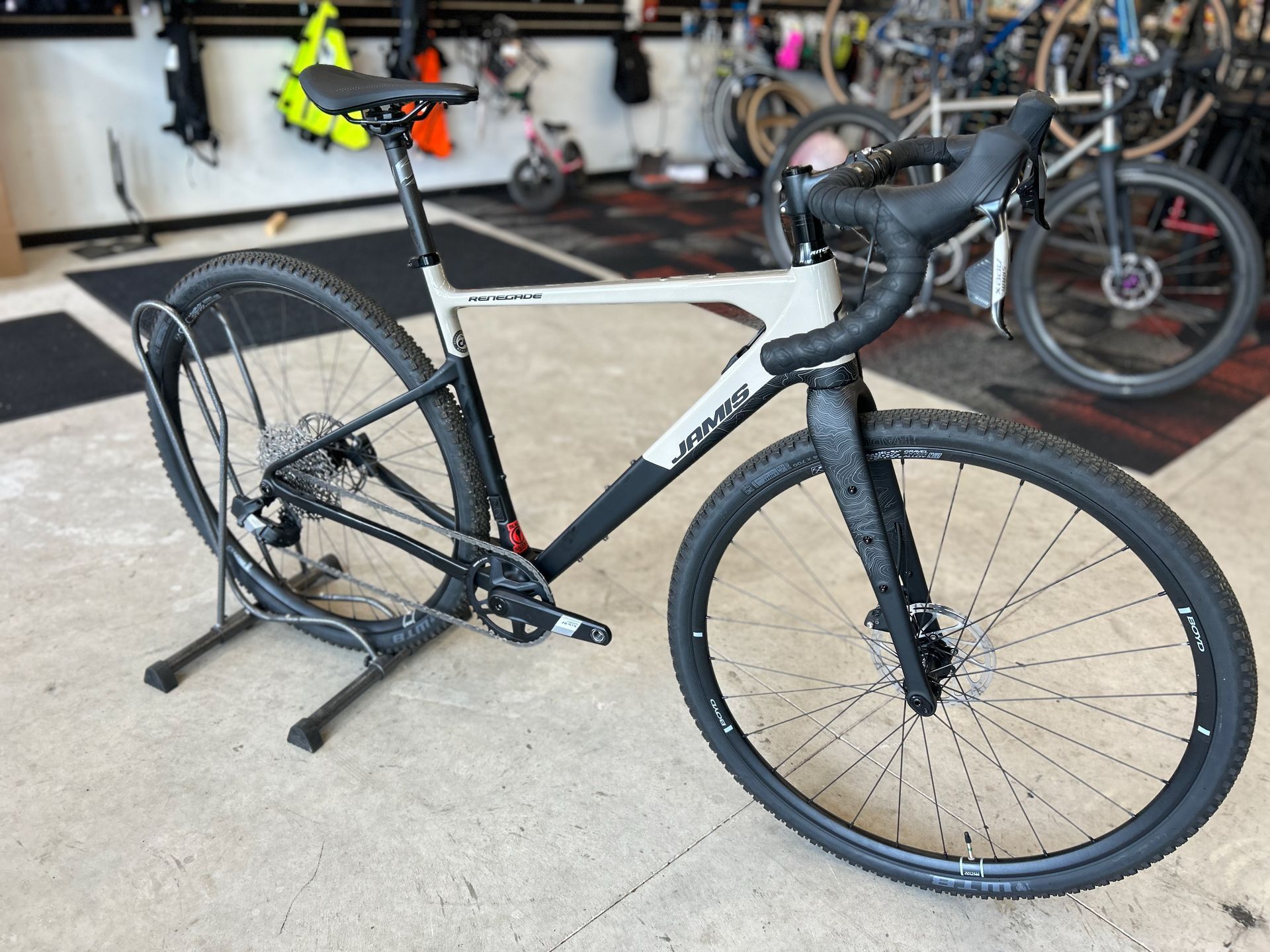 A bicycle is sitting on a stand in a store.