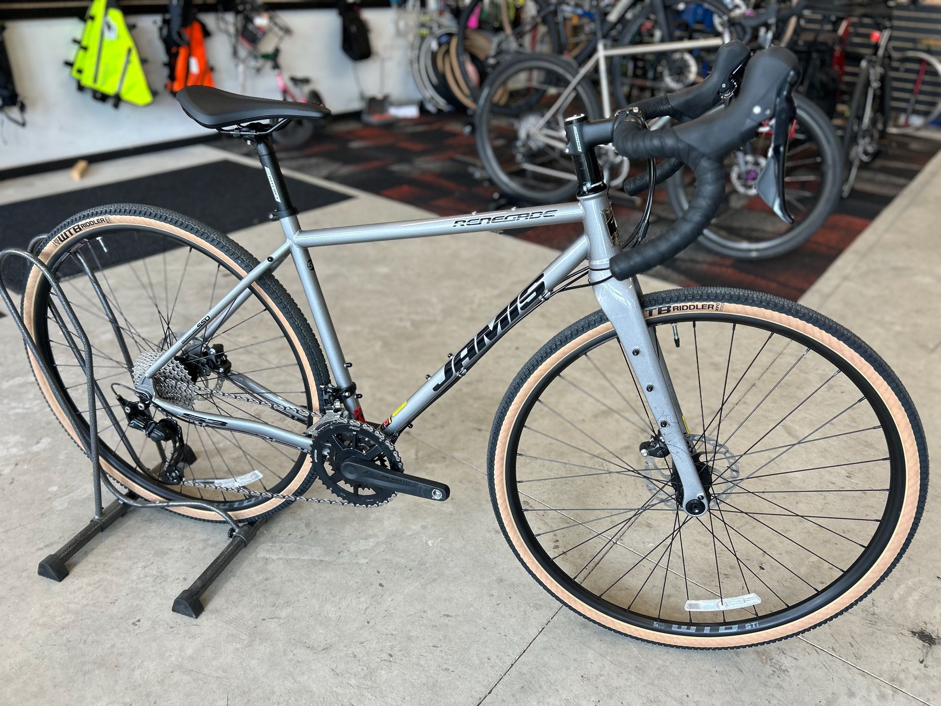 A bicycle is sitting on a stand in a store.