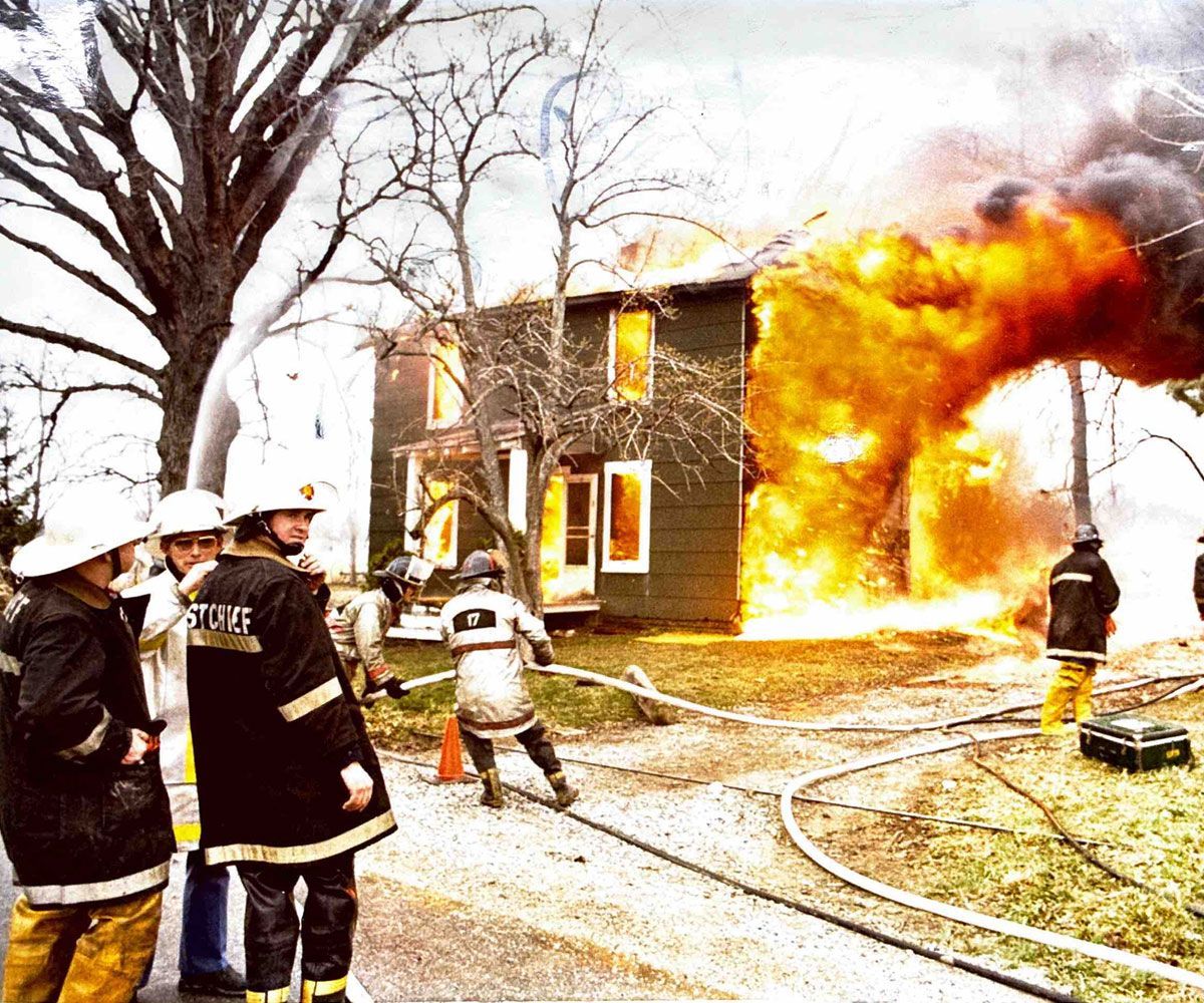 Tri Township historical photo of firemen putting out house fire circa 1960s or 1970s