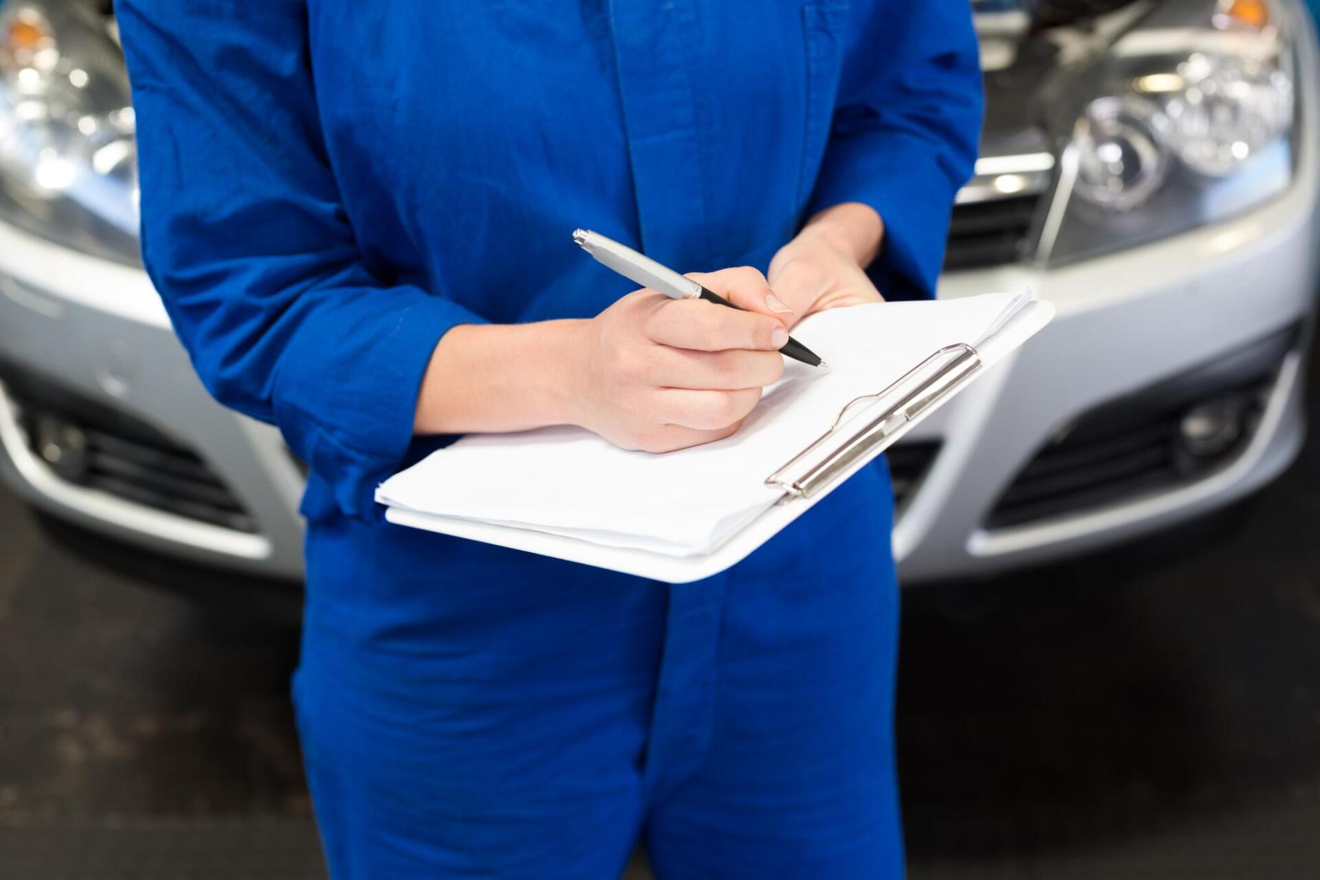 worker writing in the paper
