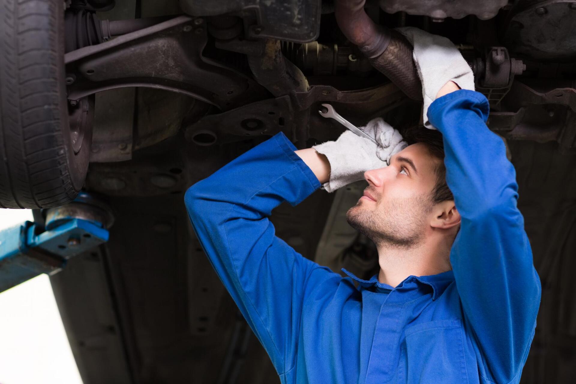 worker holding the wrench