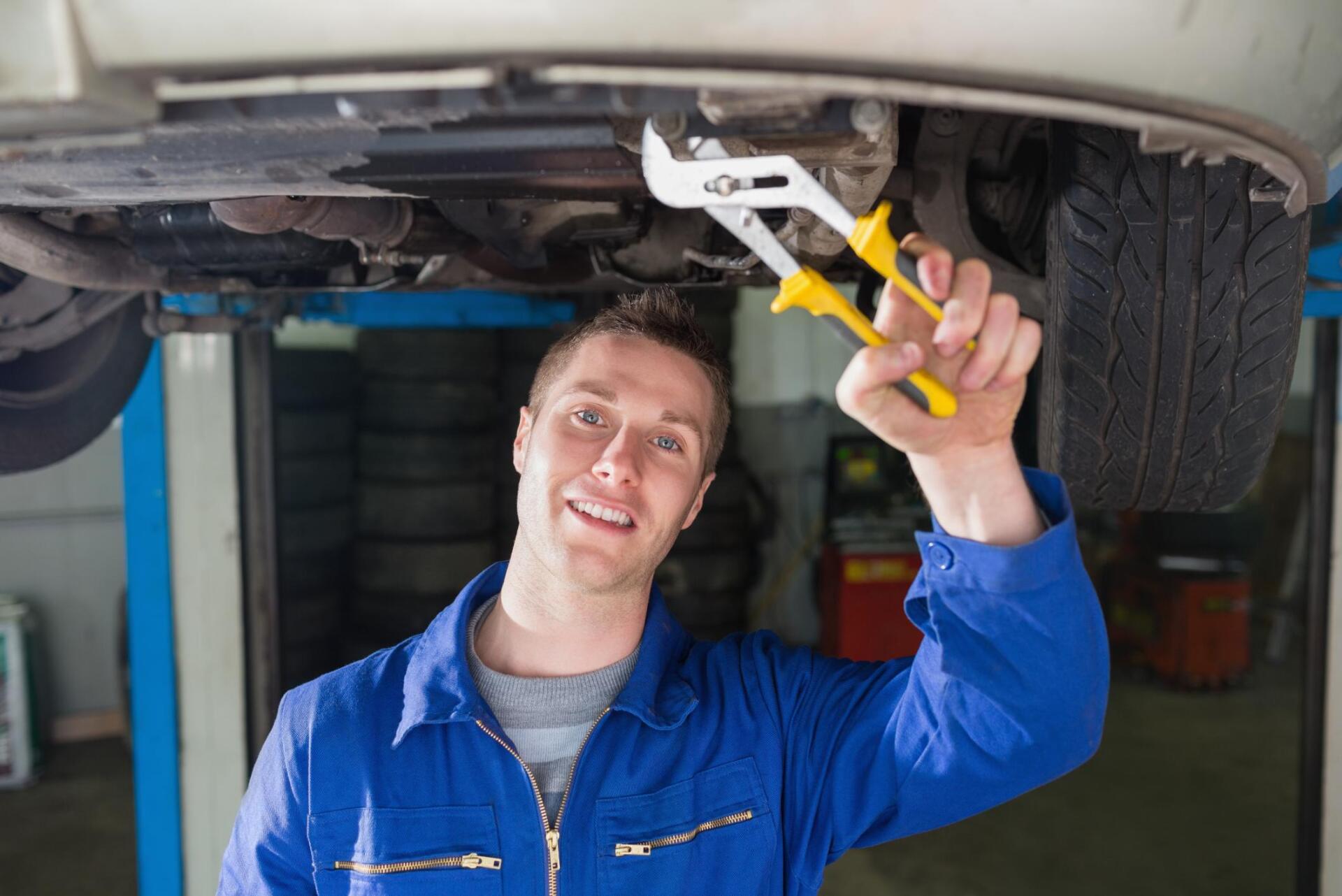 worker fixing the car