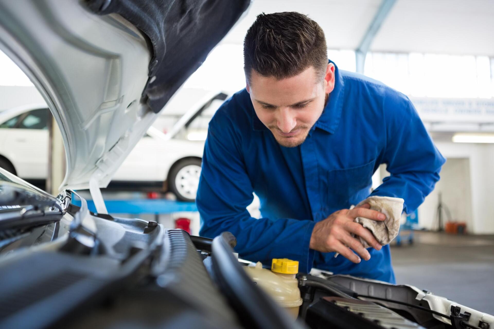 worker fixing the engine