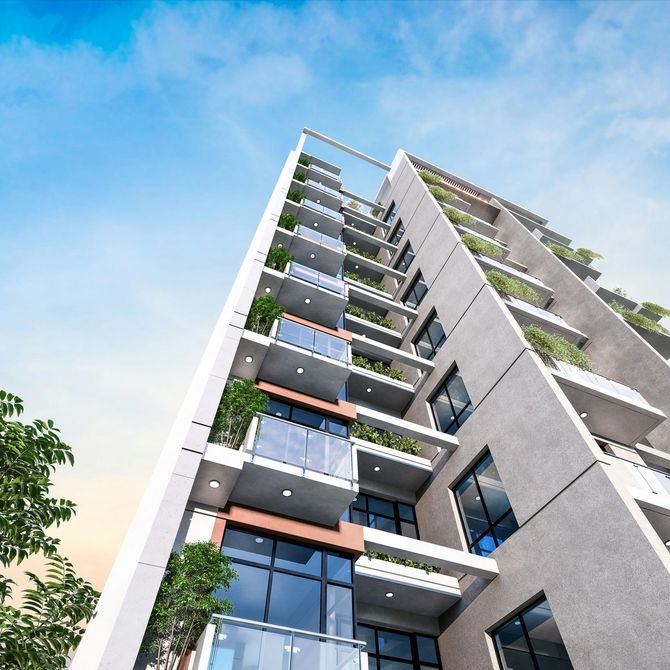Modern apartment building with balconies and glass windows viewed from below against a blue sky