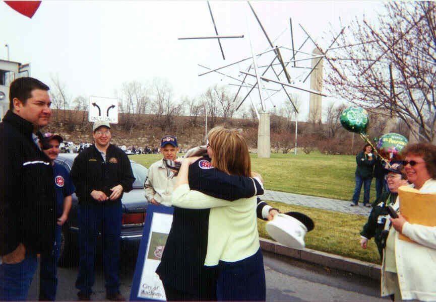 Pam Schott gets a big hug from Joe Huber