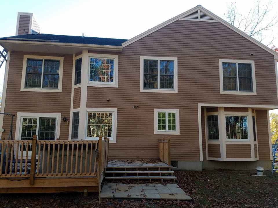 The back of a house with a deck and stairs