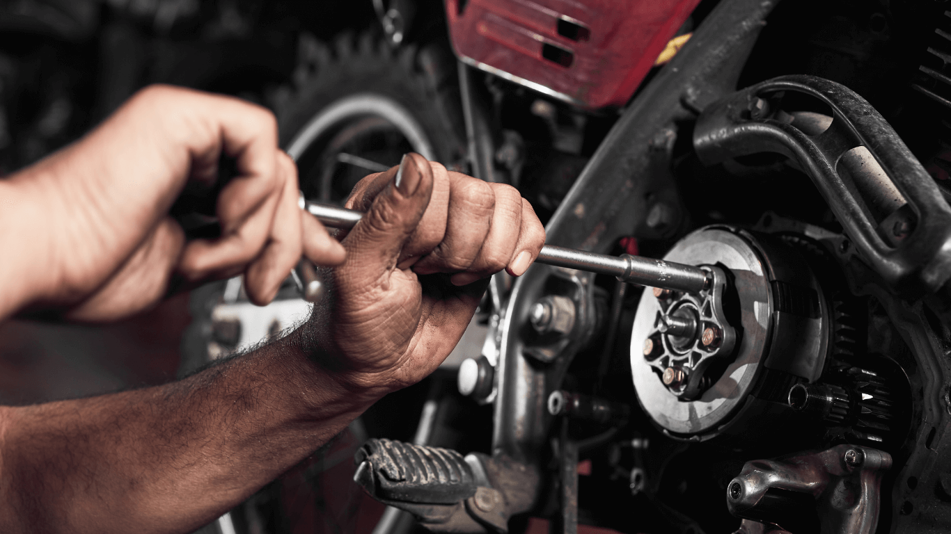a mobile mechanic using a wrench 