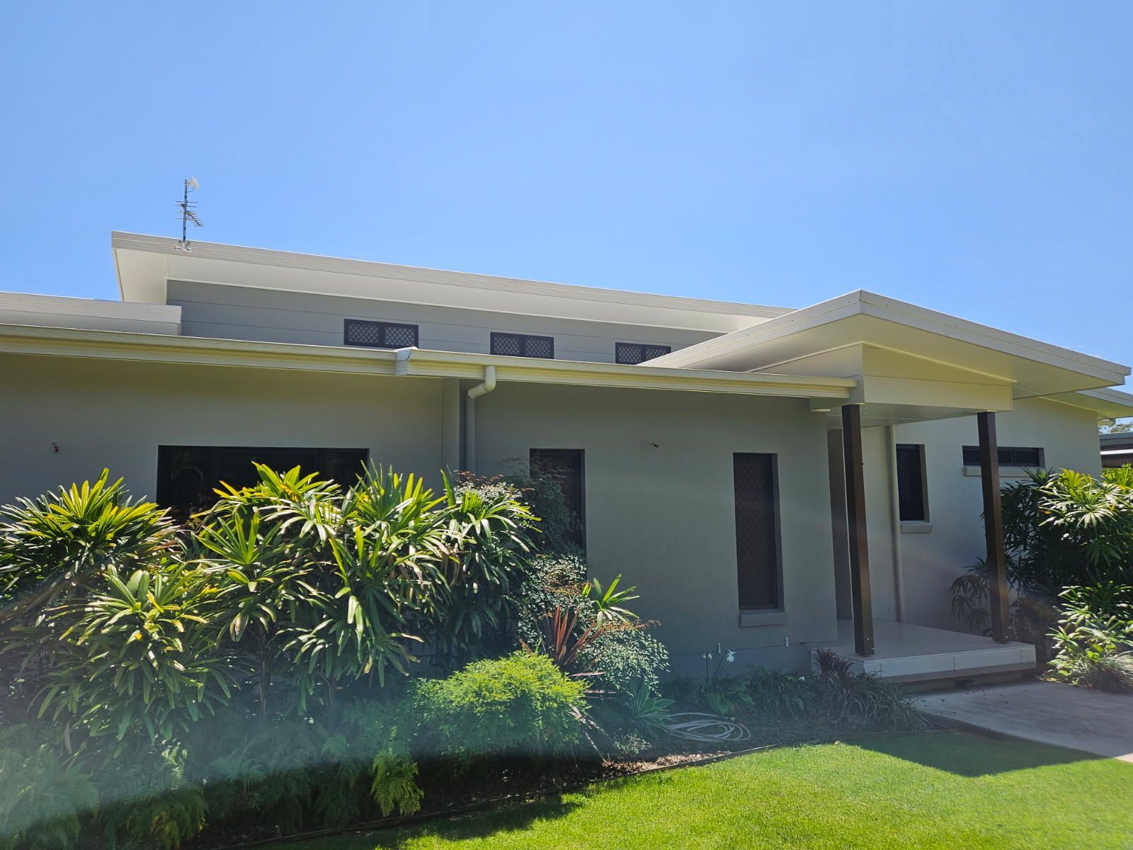 A Light Grey, Single-story House With a Flat Roof — Priority Painters in Gladstone Central, QLD