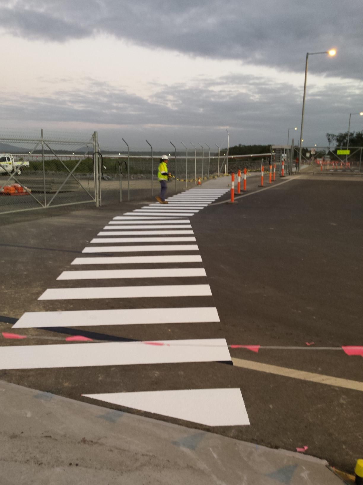 A Newly Painted White Pedestrian Crosswalk on an Asphalt Surface — Priority Painters in Gladstone Central, QLD