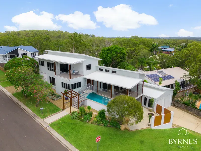 An Aerial View of a Multi-level White Modern House With a Pool — Priority Painters in Gladstone Central, QLD