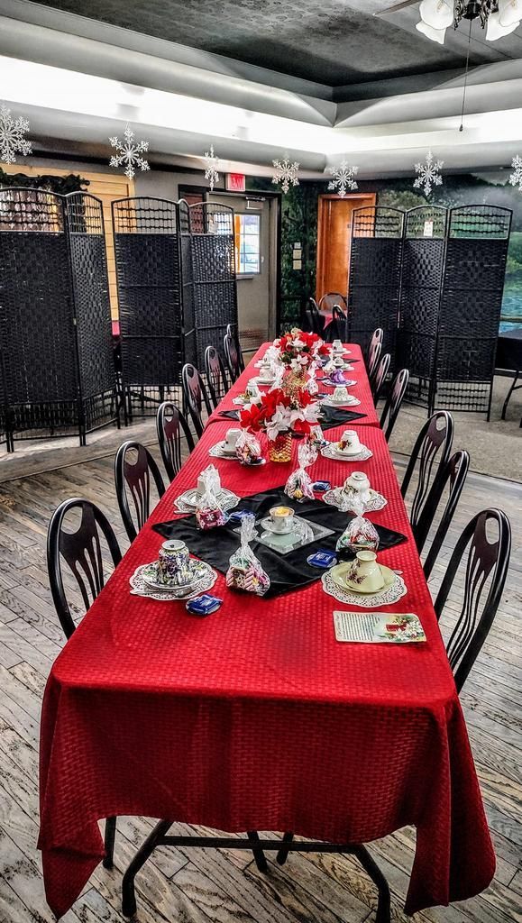 a long table with plates and cups on it
