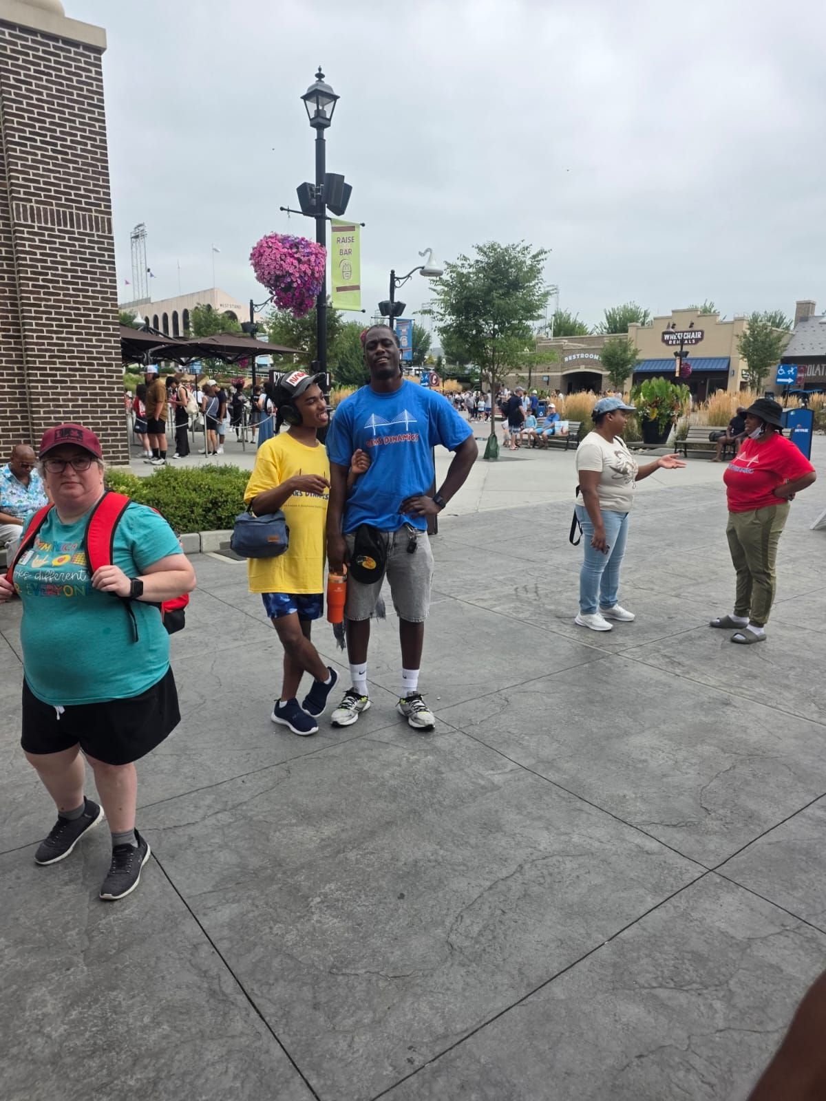 People in an outdoor shopping area. 