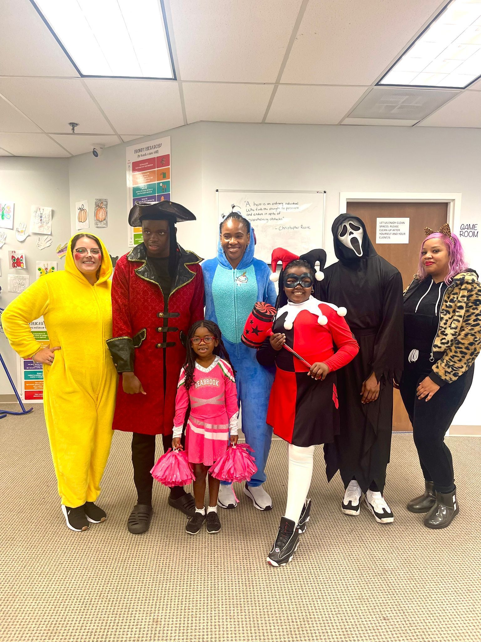 Child wearing eye mask in a store, holding up hands.