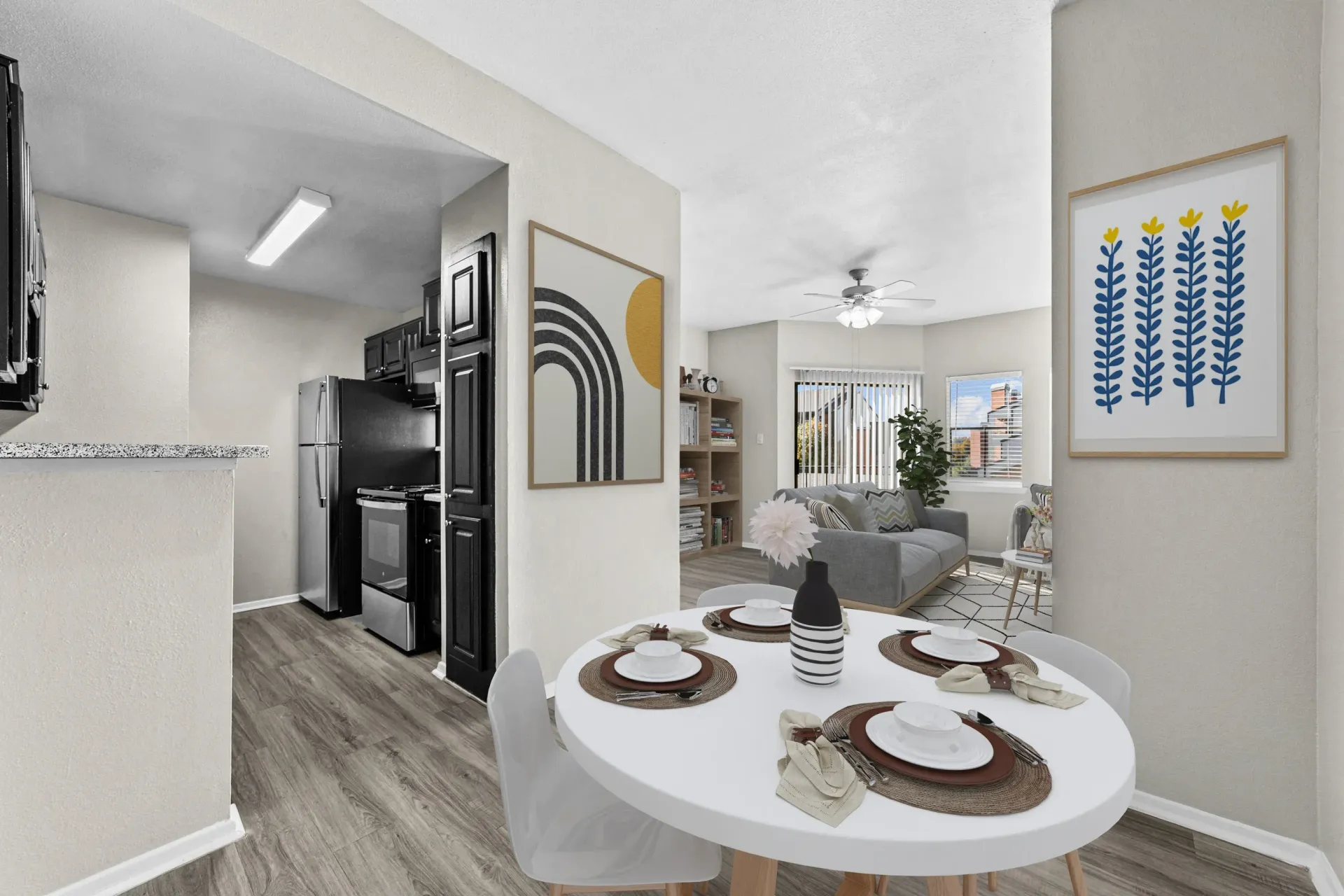 Modern kitchen and dining area with a cozy living room visible