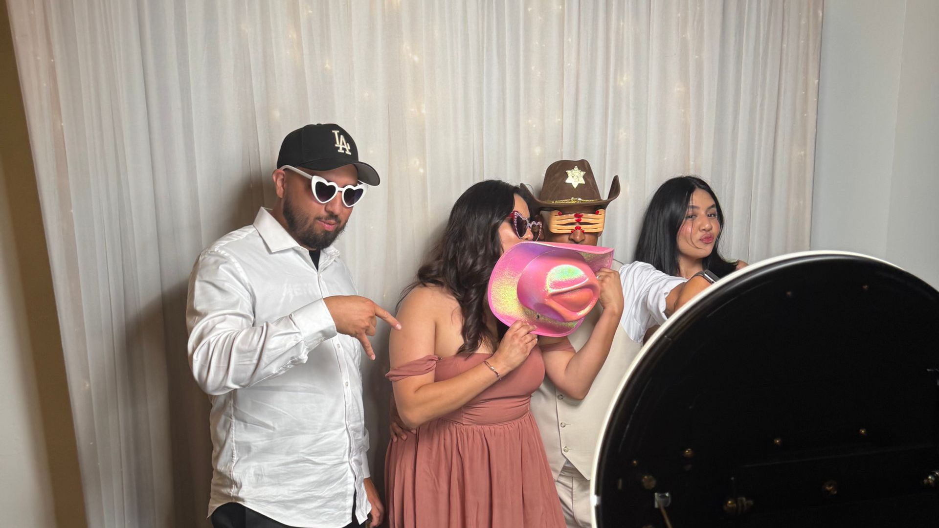 Guests having fun at the photo booth at Wedgewood Weddings Fallbrook Estate
