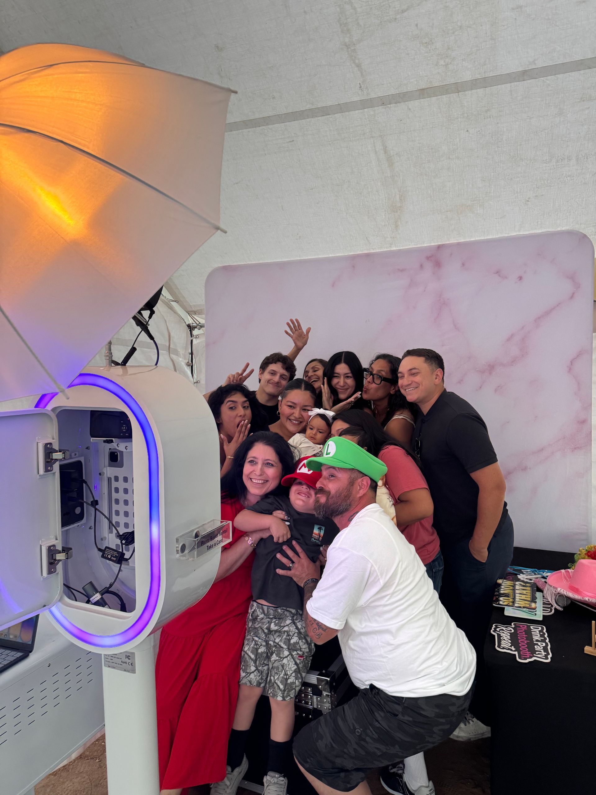 Guests enjoying Brightlight Photo Booth at Jayleen's UC Riverside graduation party in Jurupa Valley