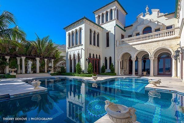 An amazing home with nice arches and a beautiful pool 