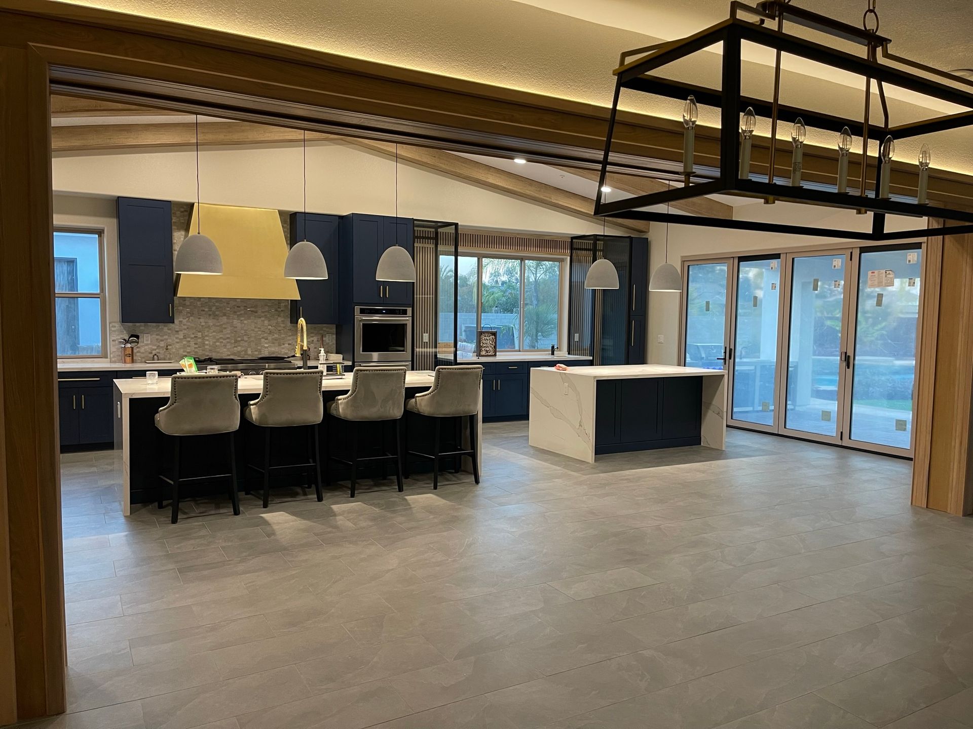 A large kitchen with a large island in the middle of the room.