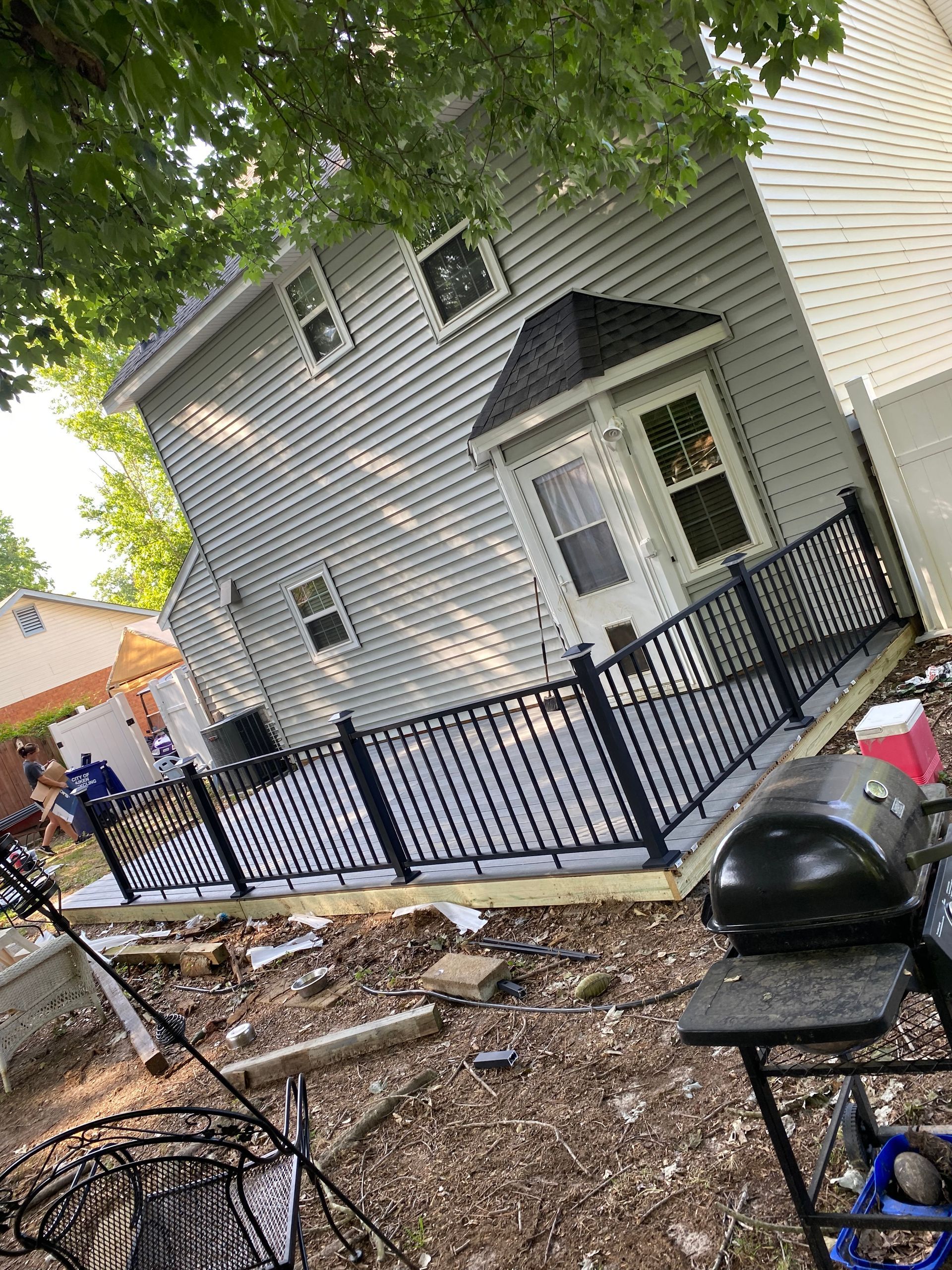 A house with a fence around it and a porch.