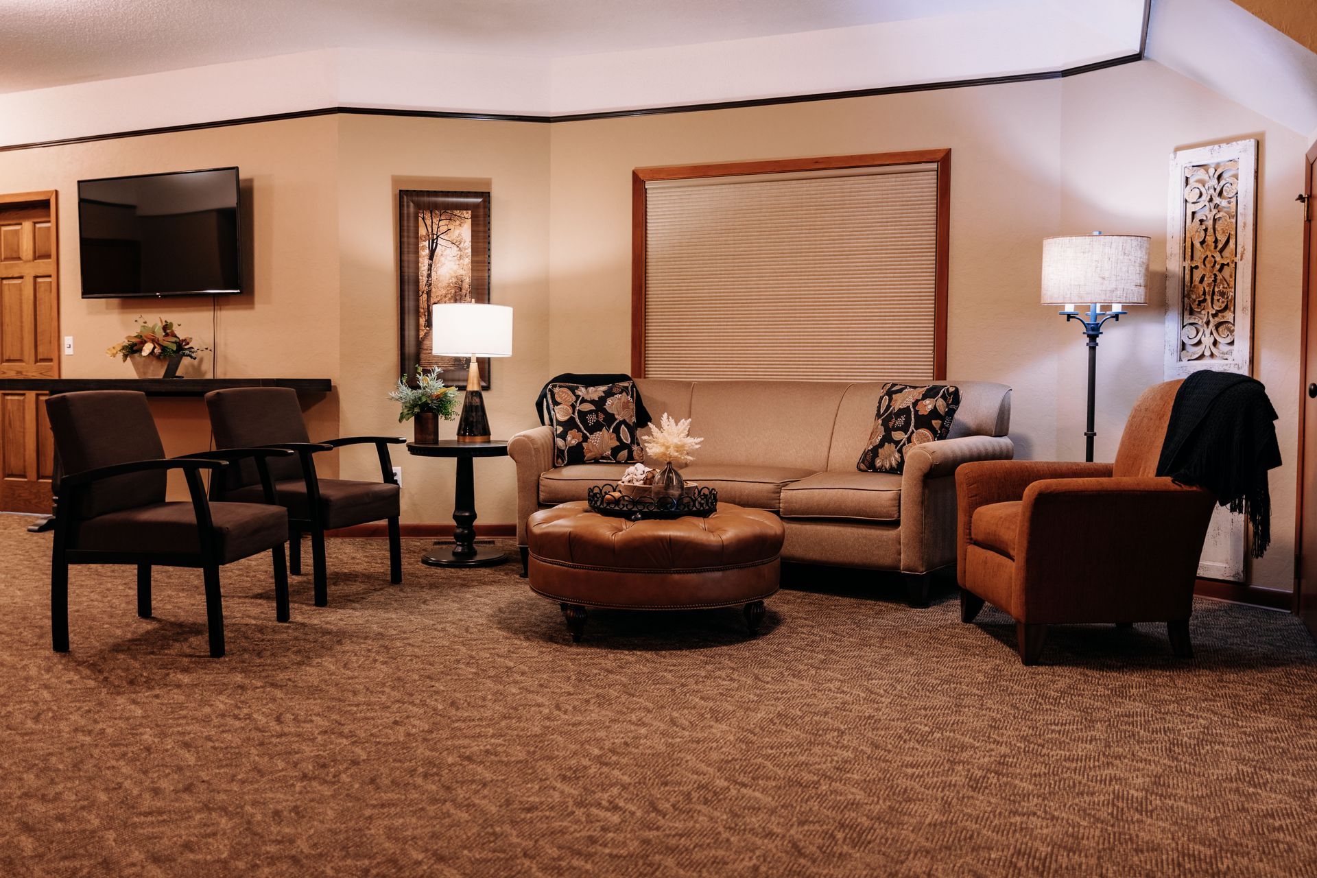 A living room filled with furniture and a television.