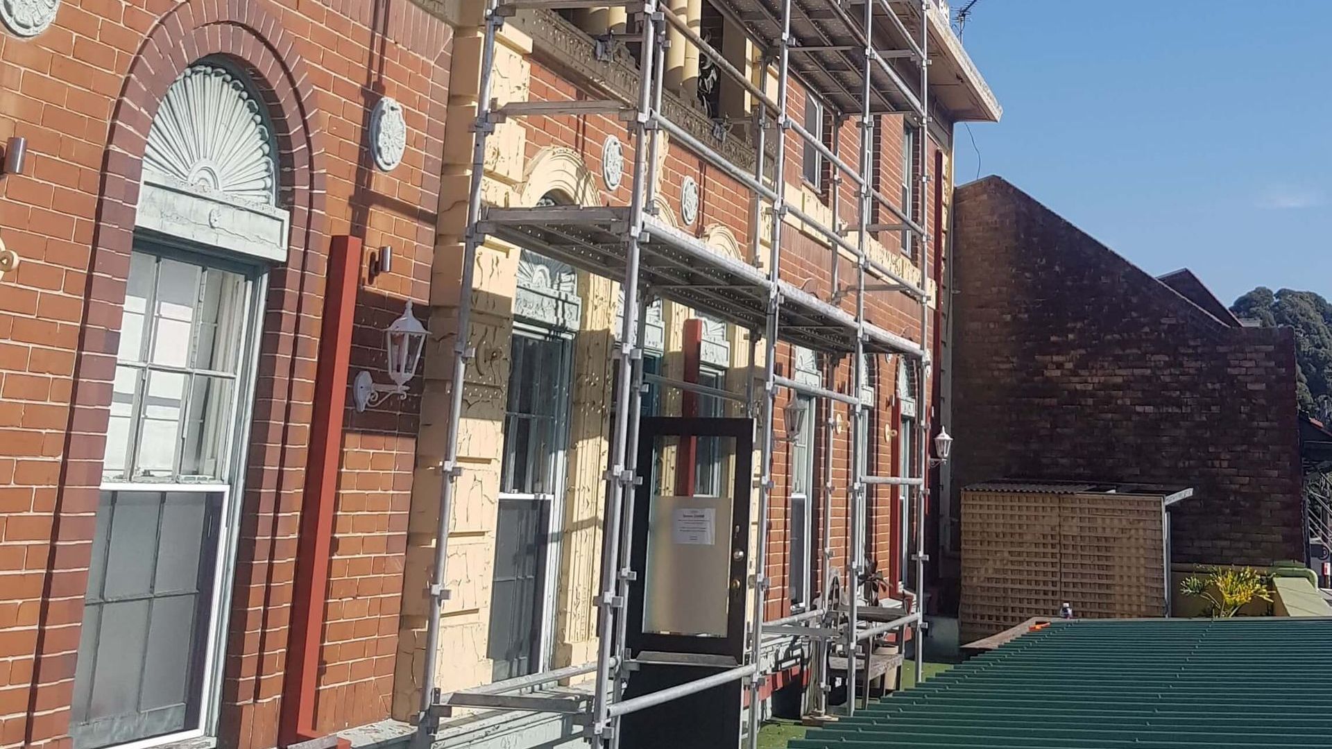 Restoration scaffold on a heritage brick building in Sydney, providing safe access for repairs and painting