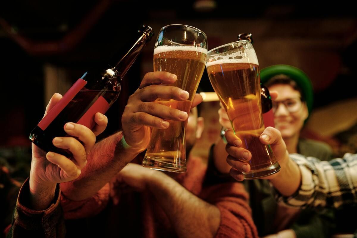 People toasting with their drinks