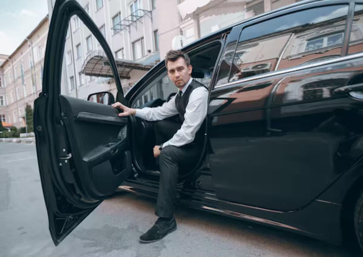 A car service driver getting out of the car