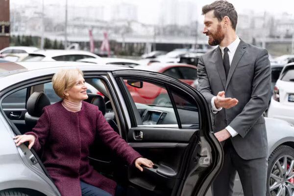 A chauffeur service driver smoothly dropping off a client
