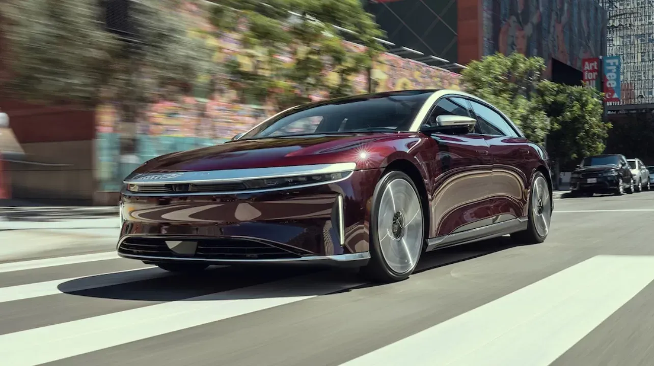 Fleet of luxury black cars beside a jet