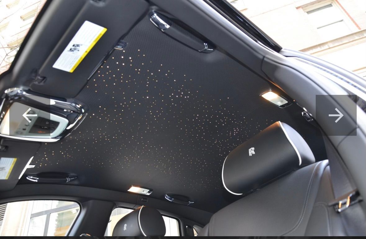 The ceiling of a car has a lot of stars on it