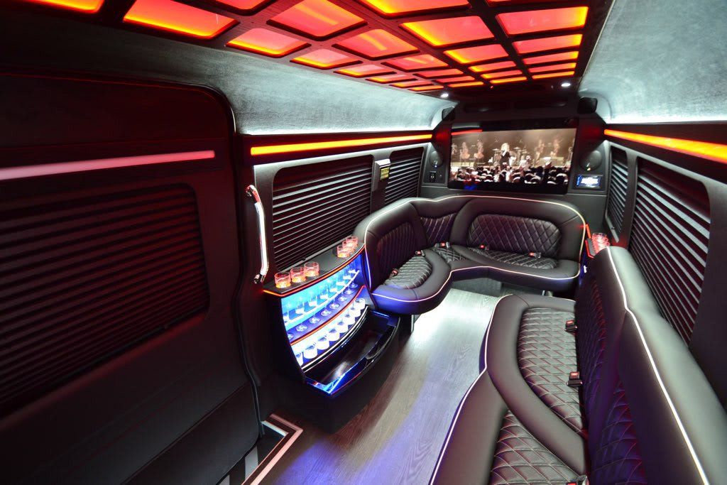 The inside of a limousine with a lot of lights on the ceiling