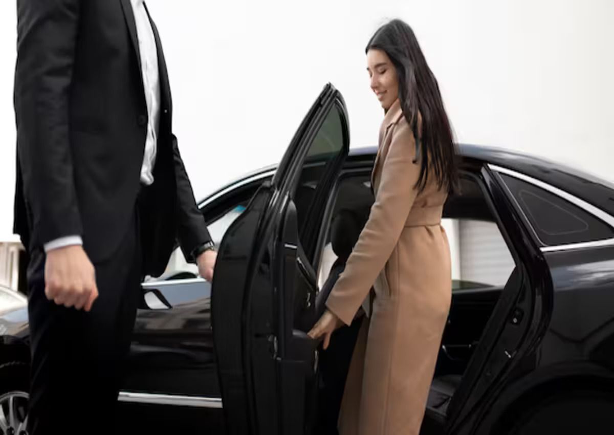 Woman getting in a luxury car service