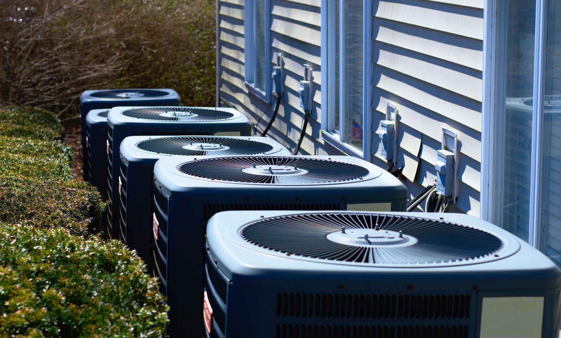 Residential HVAC units outside building