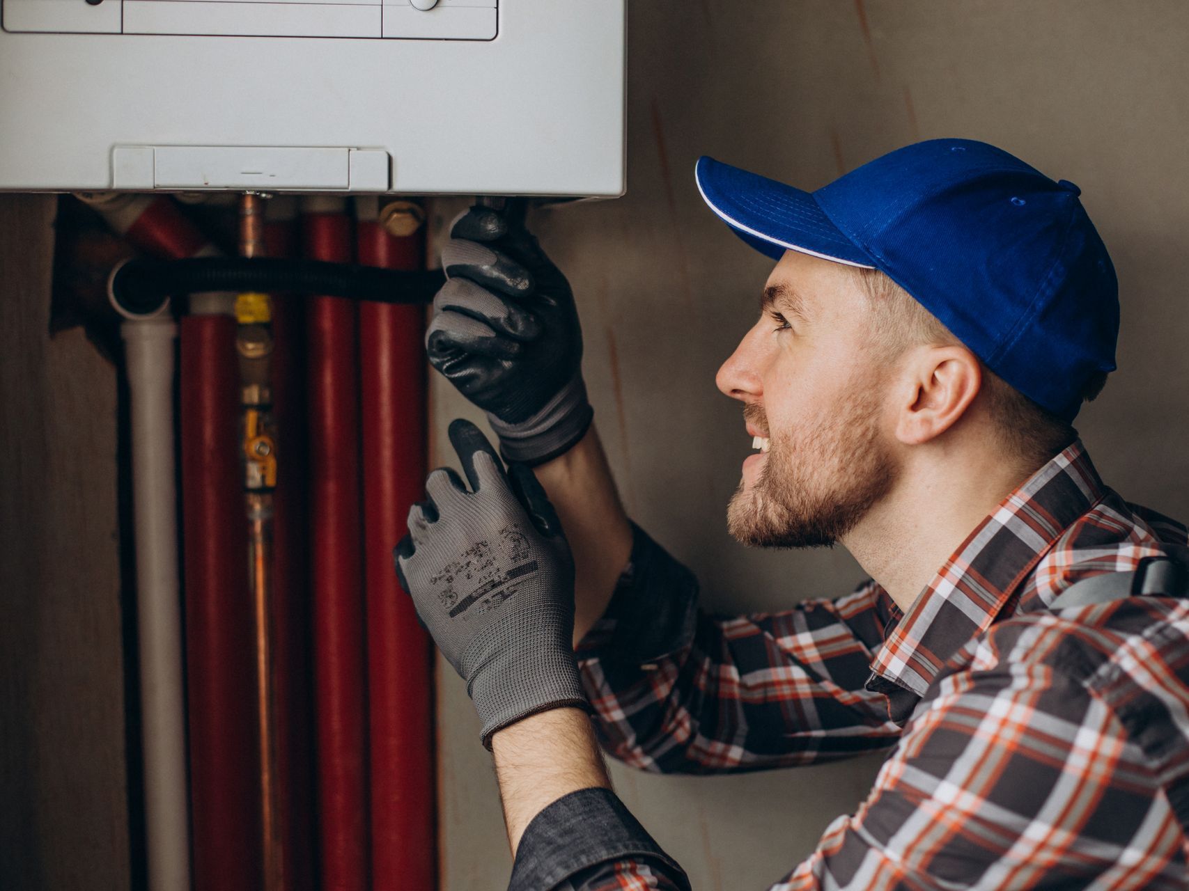 HVAC technician repairing residential heating and cooling system