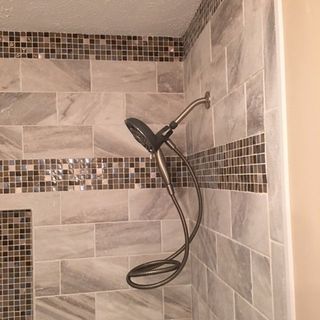 tiled shower with shower head